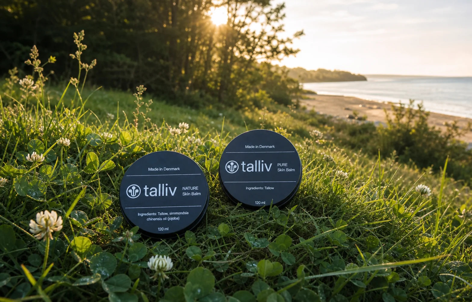 Pure and Talliv Nature Skin Balm in clover and grass with woodland, beach and evening sun